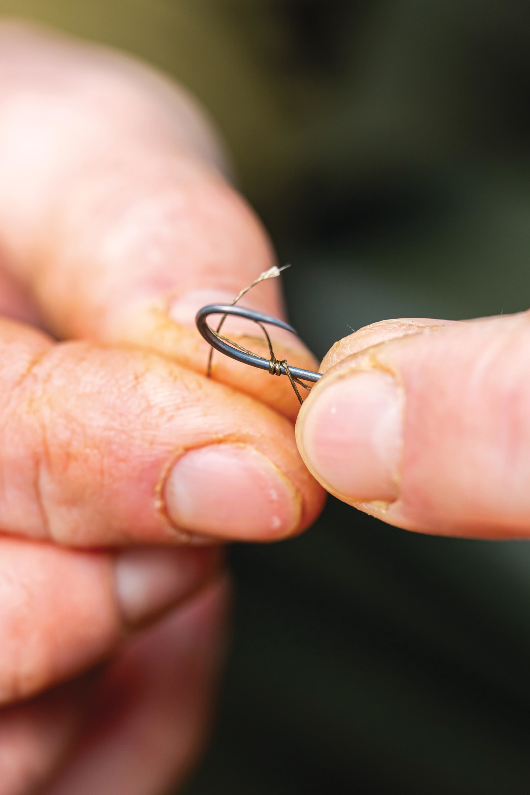 Whip the braid around the hook shank three times. 