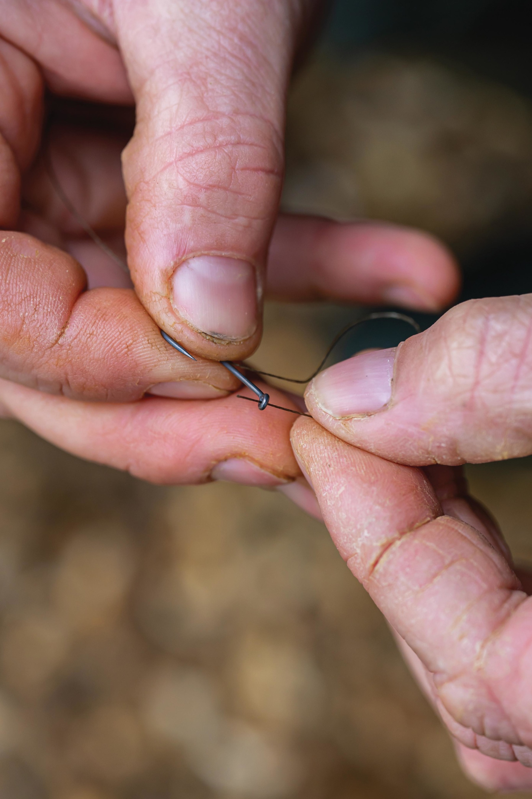 Secure the hook using a Three-Turn Knotless Knot. 