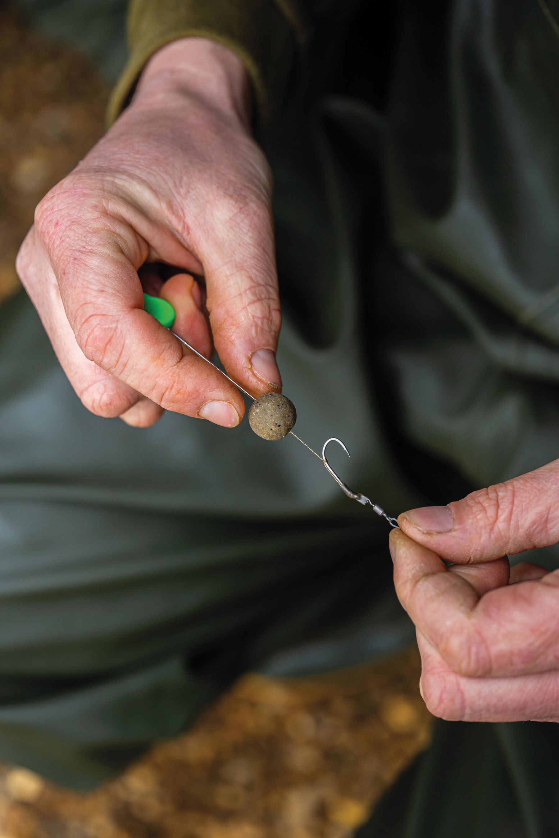 Slide your bottom bait onto the hair using a baiting needle. 